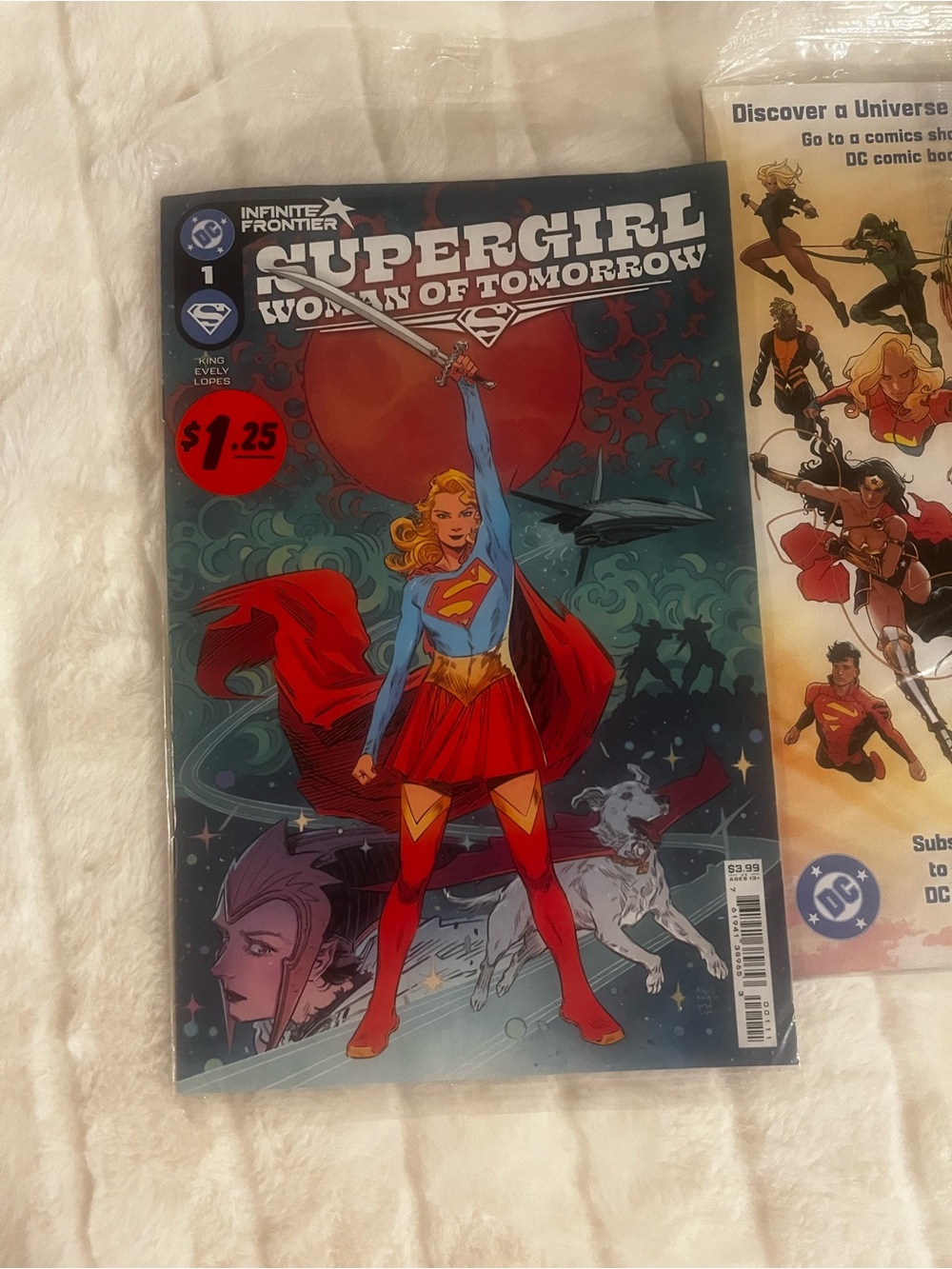 DC Universe Heroes comic books - Red, Blue & Yellow Artwork sticker is on plasti